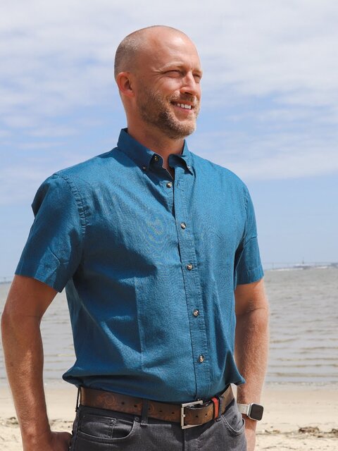 Dylan Tullberg smiling at the beach